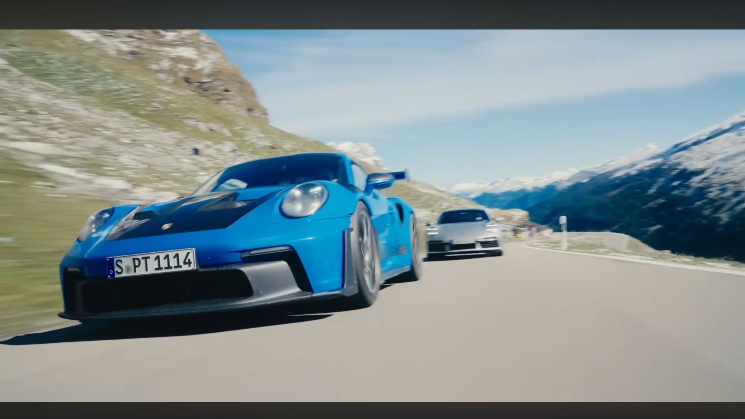 Blue 911 on a mountain road