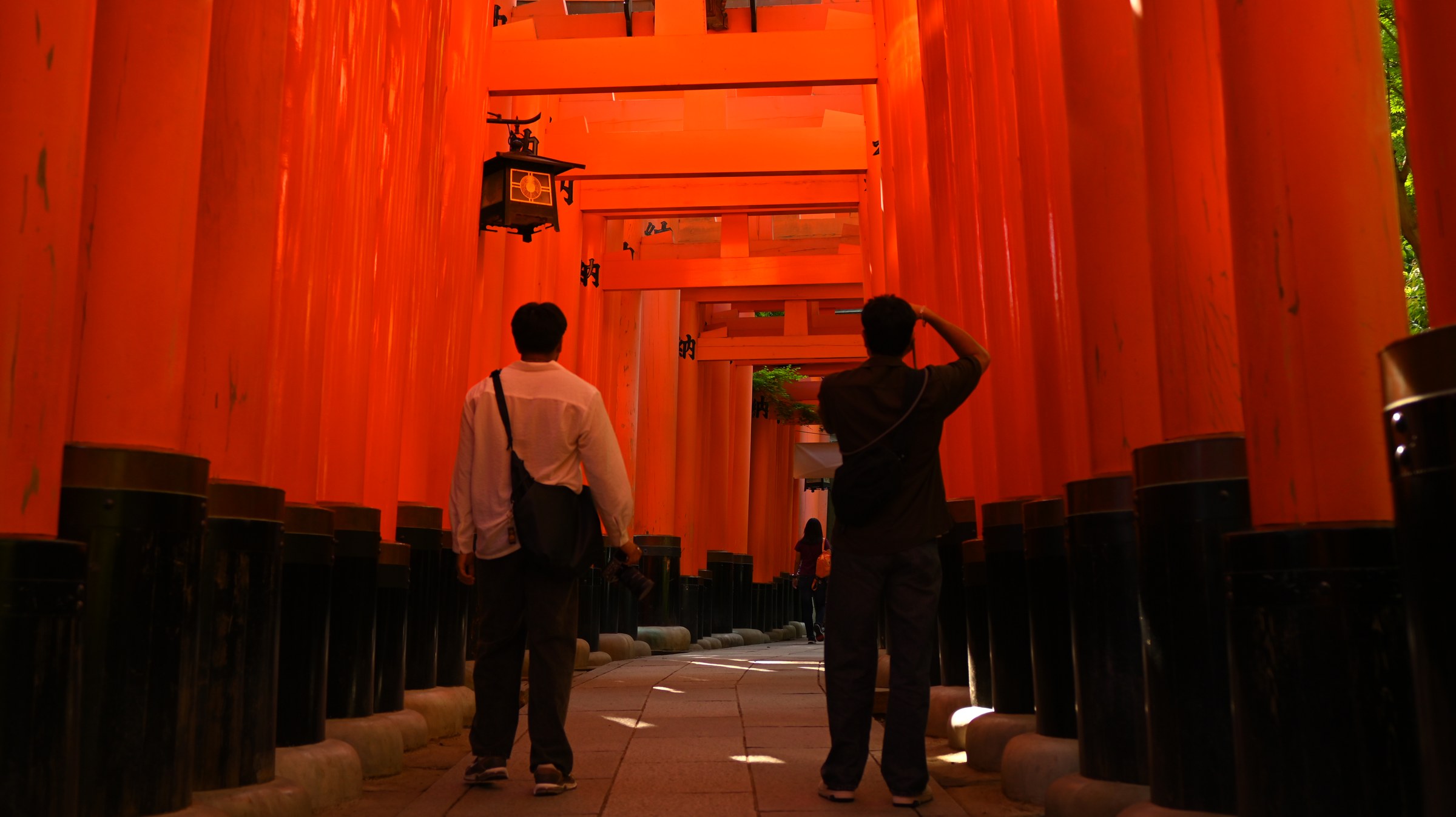 Walking through the red torii at Fushimi Inari