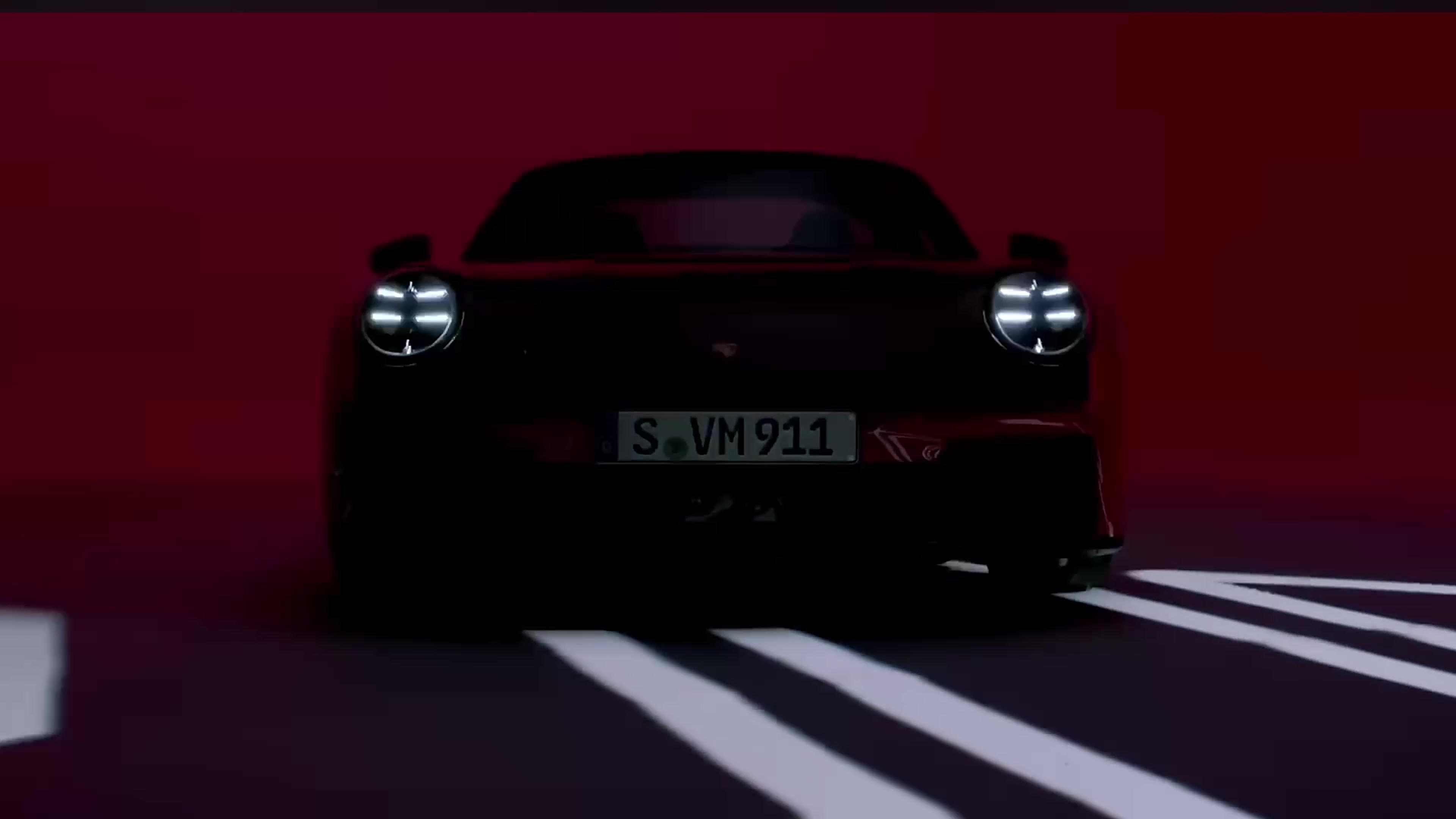 Dark 911 silhouette, headlights on