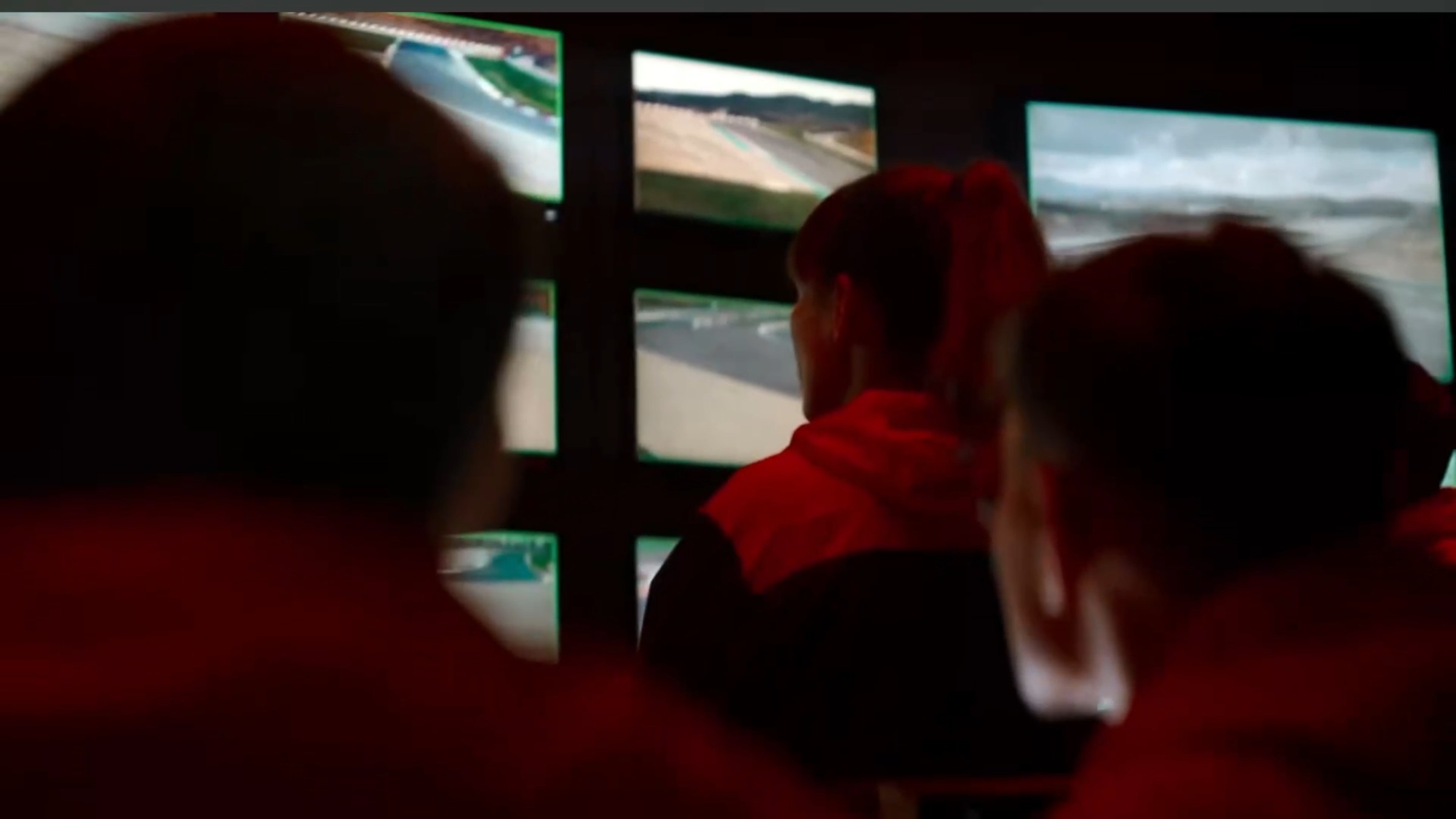 Audience in red light watching the film
