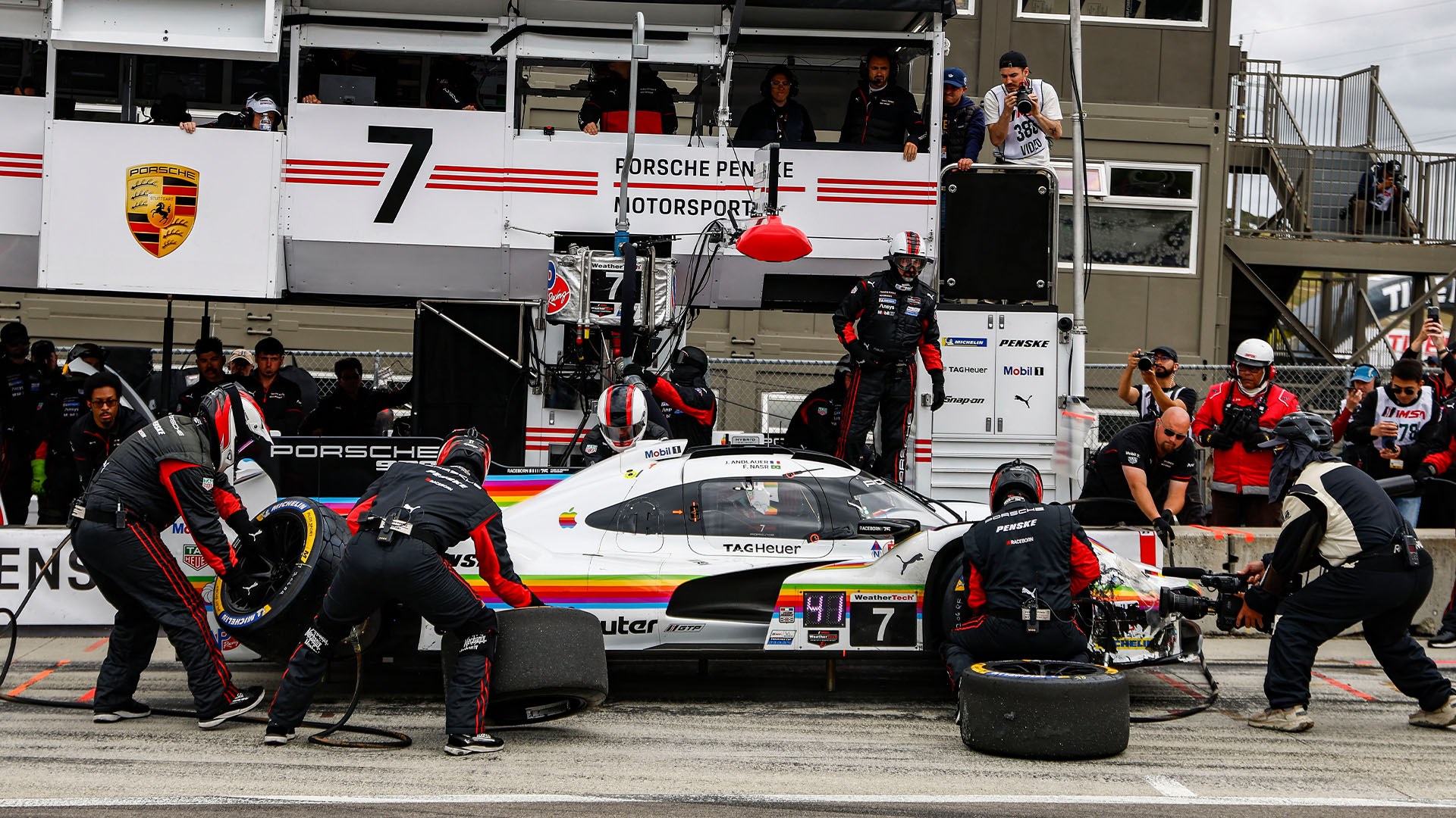 Pit stop — crew changing tyres on the number 7 car