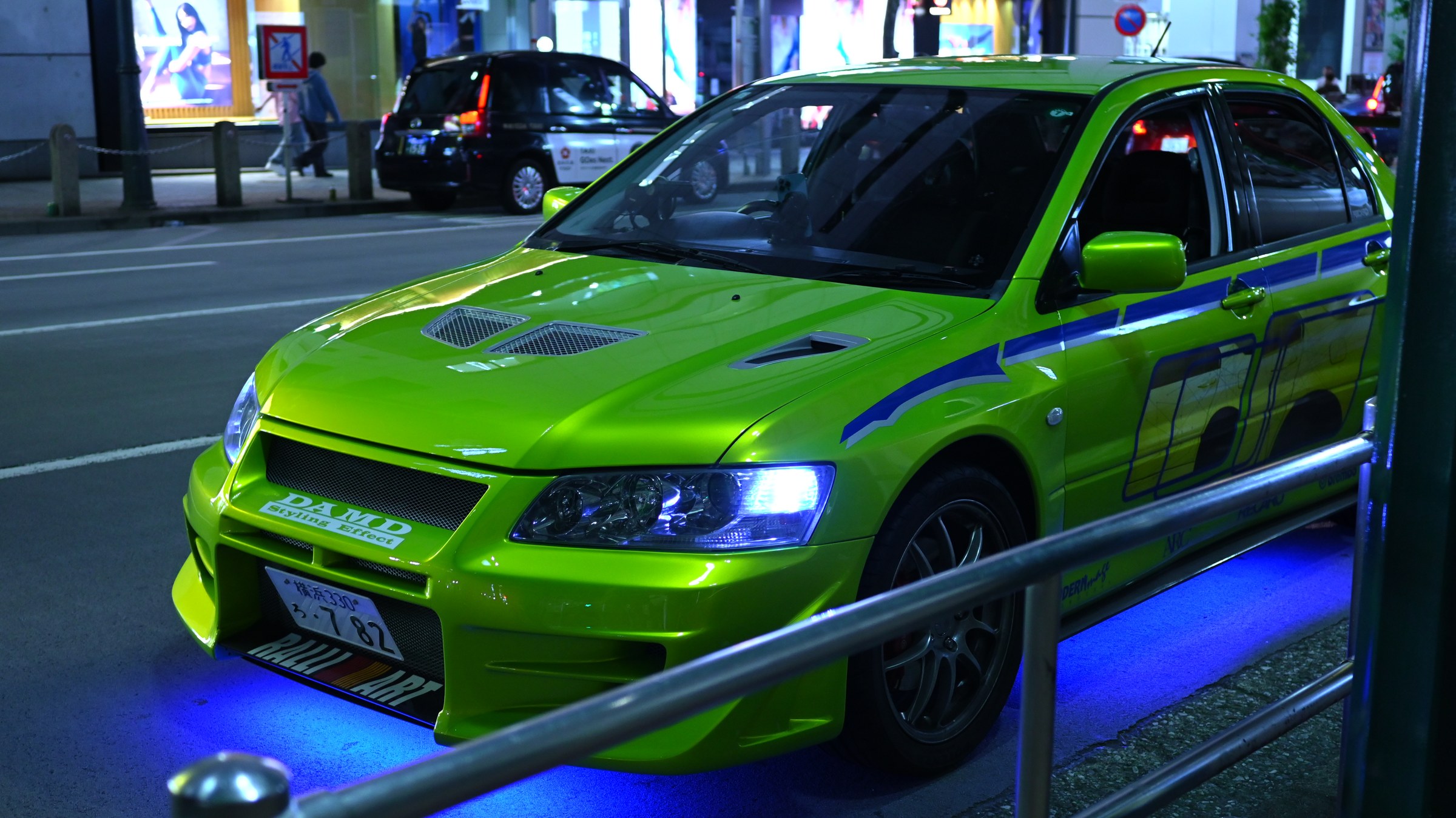 Green Lancer Evolution under neon