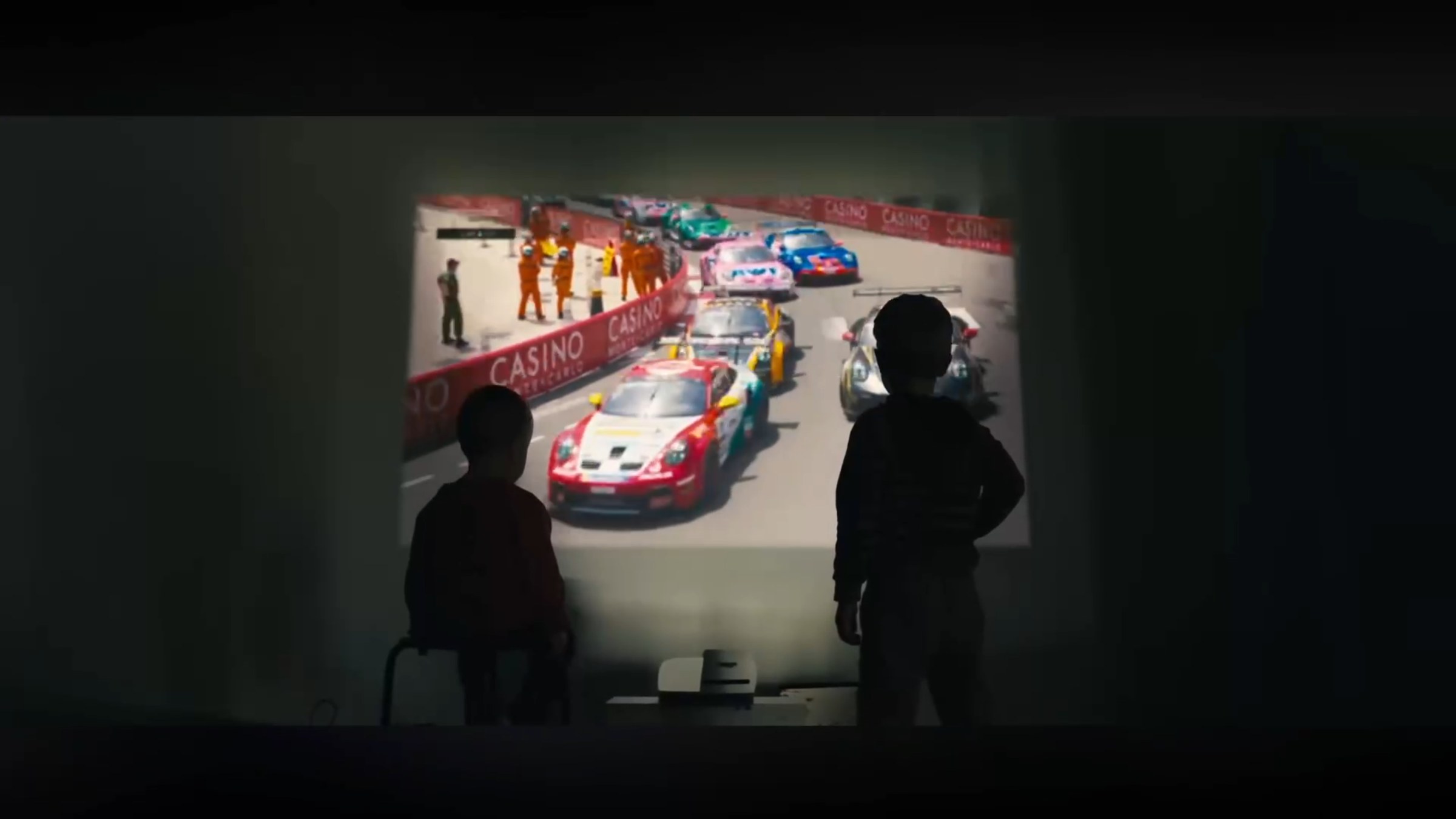 Child watching the film projected on a wall