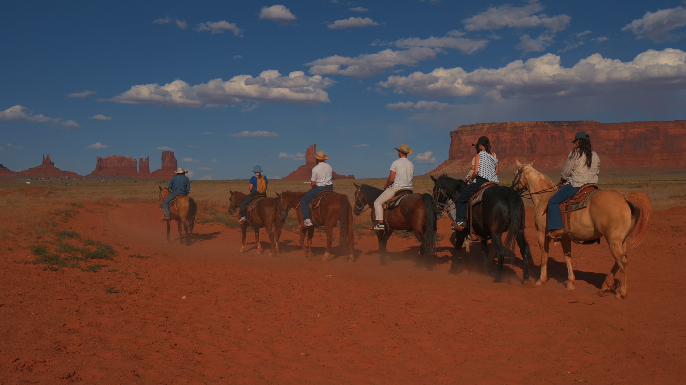 Riders in a line across the desert