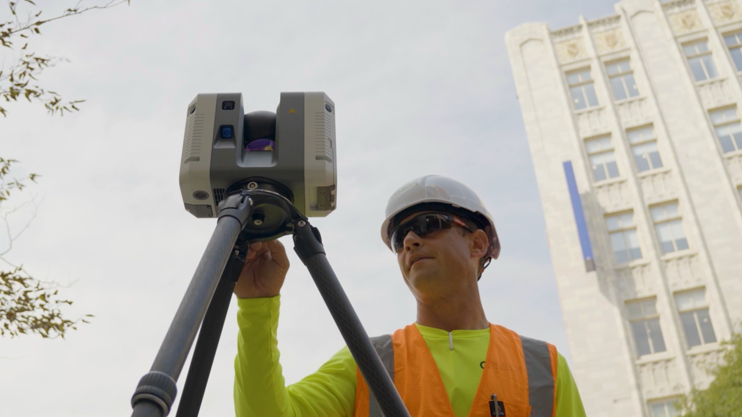 Scanner on a tripod with a surveyor