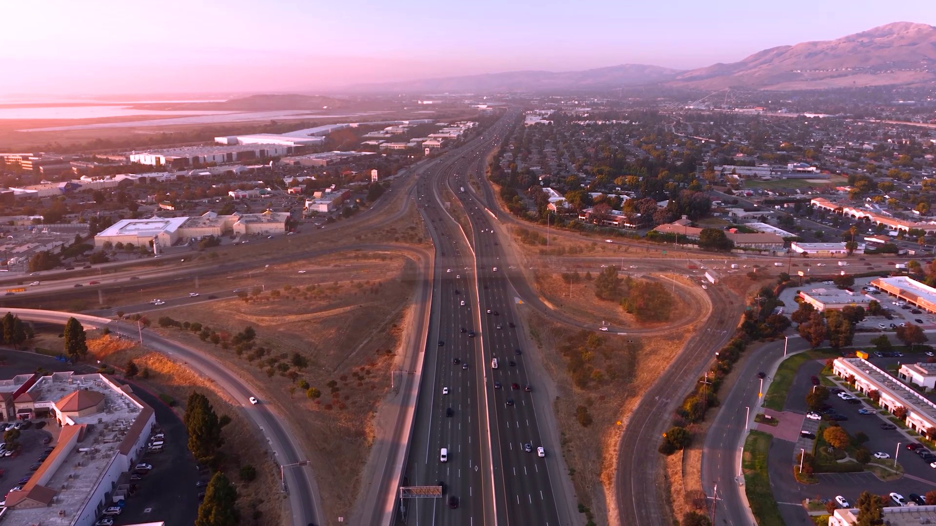 Freeway interchange at dusk, aerial