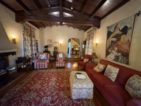 Scouted living room with warm lamps and red sofa