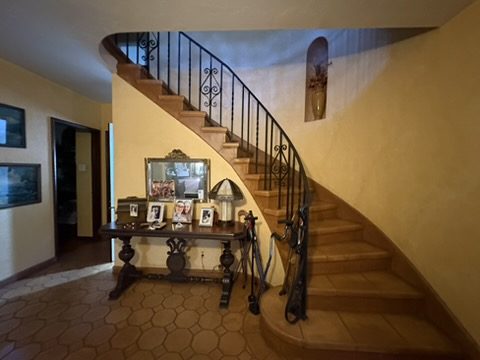 Scouted curved staircase in warm light