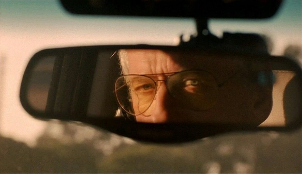 Eyes watching in a rearview mirror