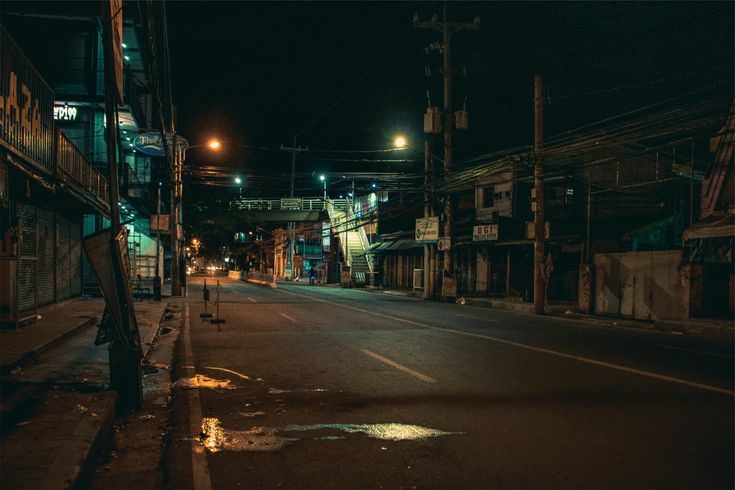 Empty street at night in teal light