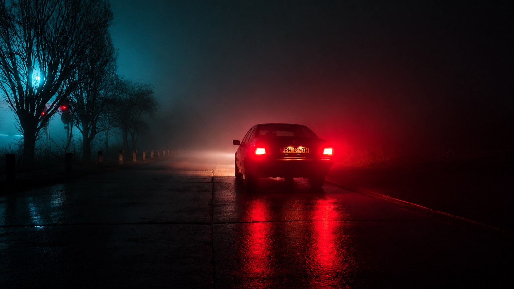 Car taillights glowing red in fog